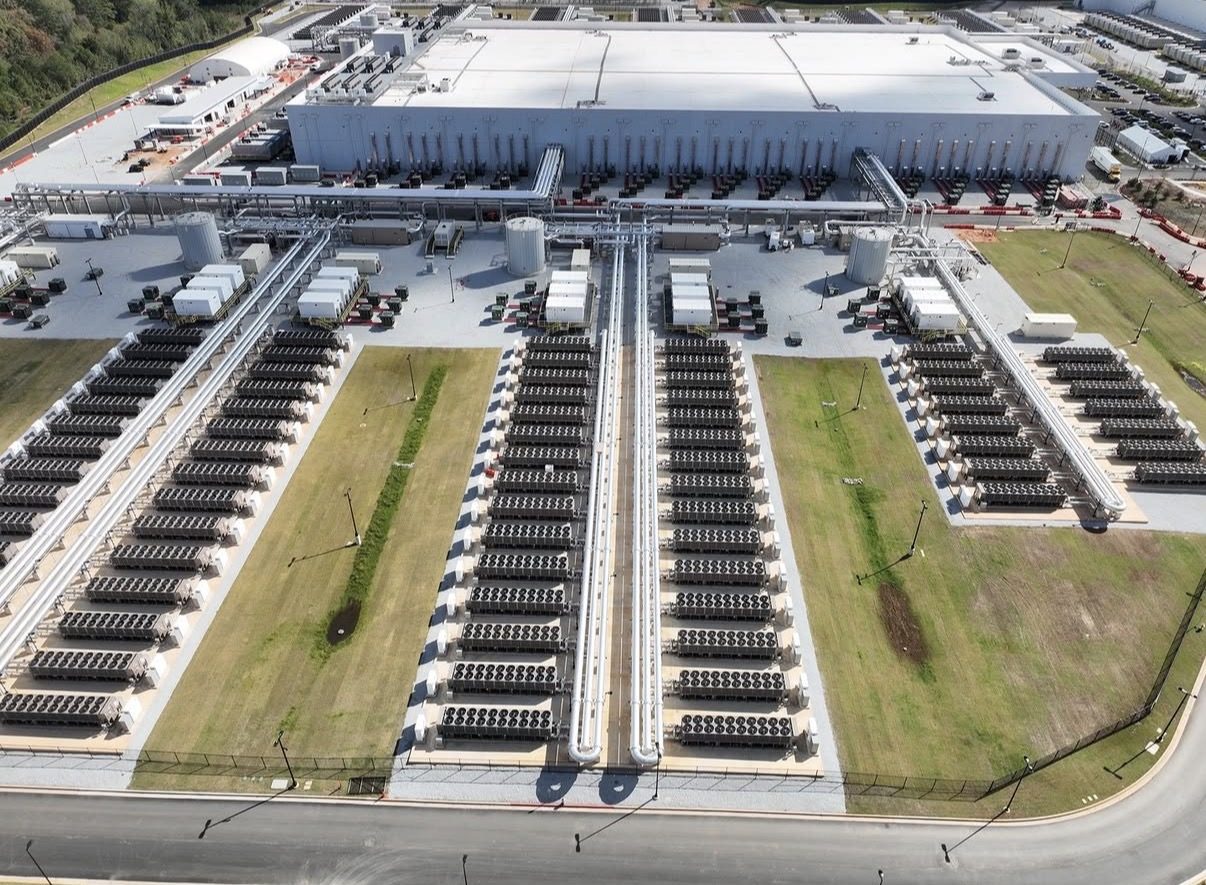 Rows of backup generators beside a data center campus